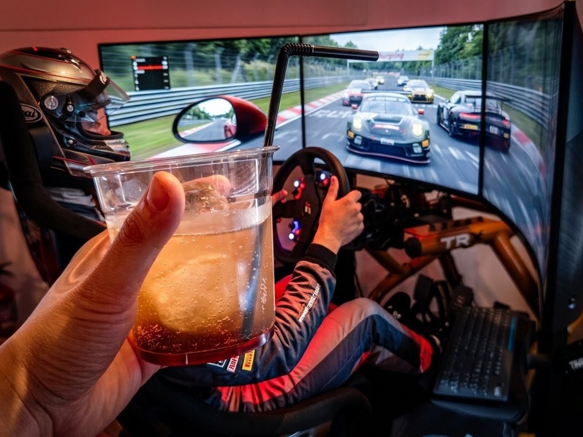 Racing simulator at mbPIT Shibuya with a drink in hand
