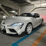 白いA91スープラの駐車場での外観写真