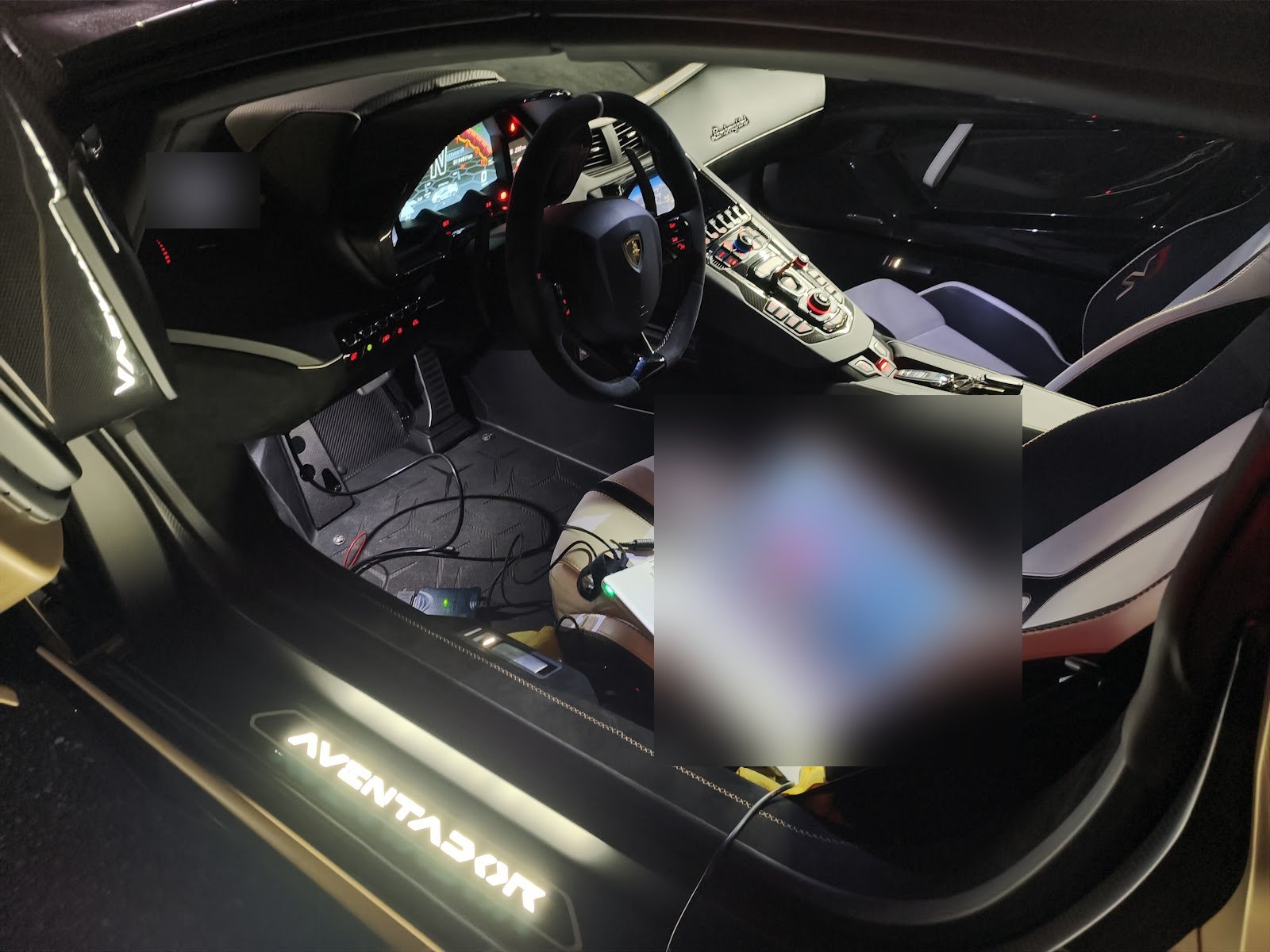 Laptop connected to the Aventador SVJ OBD port from the passenger seat